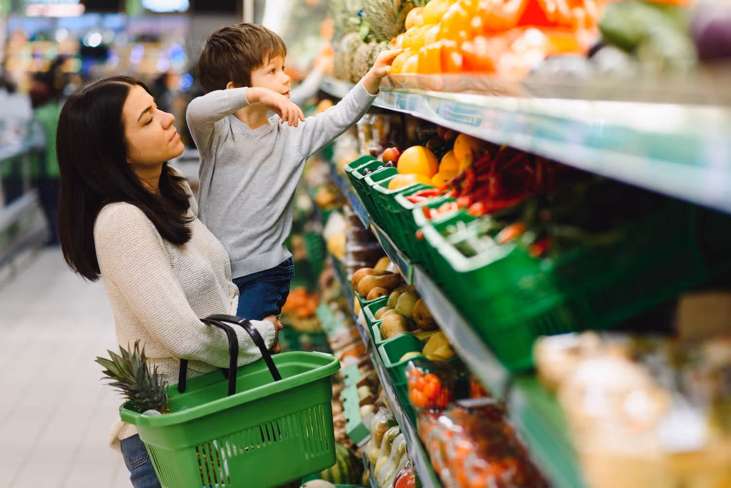 Mom and child grocery shopping